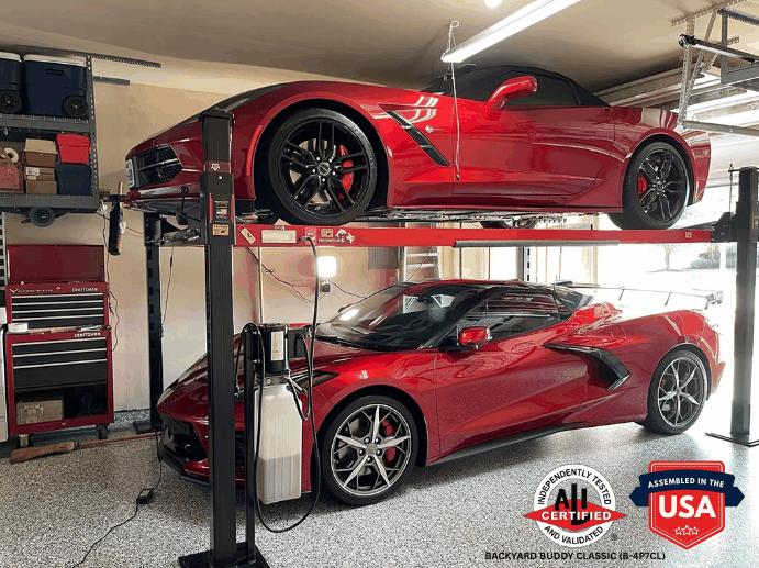 Backyard Buddy Classic 4 post lift holding two red sports cars in a garage with low ceiling clearance