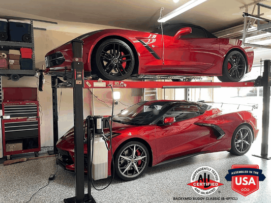 Backyard Buddy Classic 4 post lift holding two red sports cars in a garage with low ceiling clearance