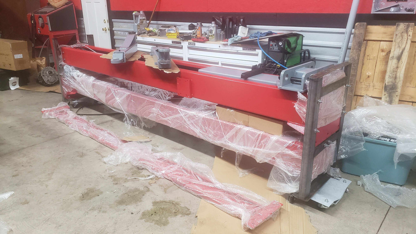 Advantage AL-12C 2-post lift with truck elevated in garage.