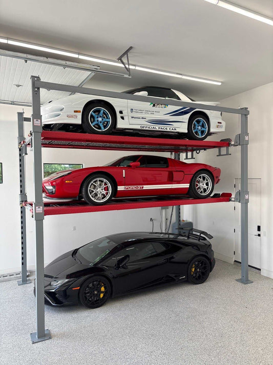Advantage Single-Wide Triple Stacker lift with three cars stacked in a garage for optimized parking and storage