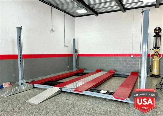 Backyard Buddy Side by Side double vehicle 4-post car lift with 10,000 lbs capacity and aluminum ramps in garage