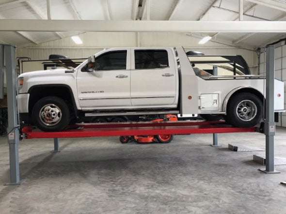 Advantage DX-11000-WD in a garage with a large white truck on top