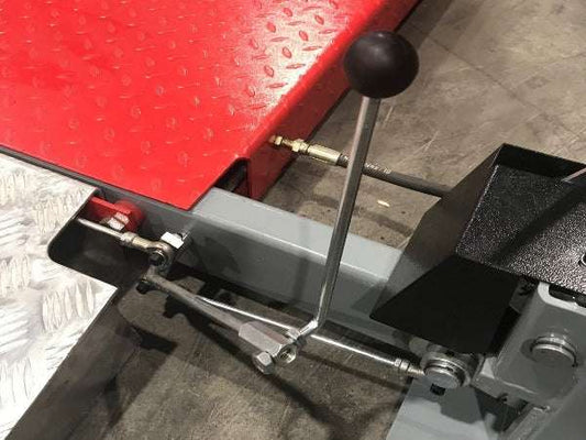 Release handle extension with black knob for easier lock release on lift systems