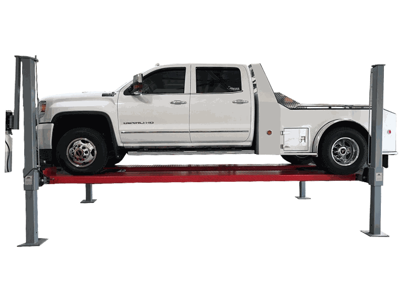 A cut out, transparent photo of the Advantage DX-11000-WD in a garage with a large white truck on top