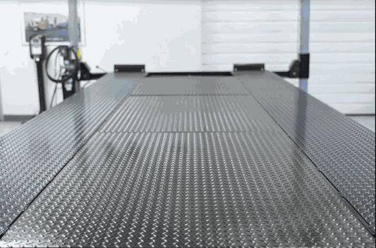 close-up of metallic solid deck insert with diamond plate texture for Backyard Buddy lift platform