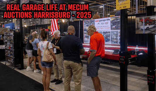 People gathered at Real Garage Life booth during Mecum Auctions Harrisburg 2025 event