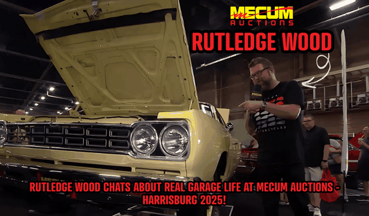 Rutledge Wood discussing Real Garage Life beside a classic car at Mecum Auctions Harrisburg 2025