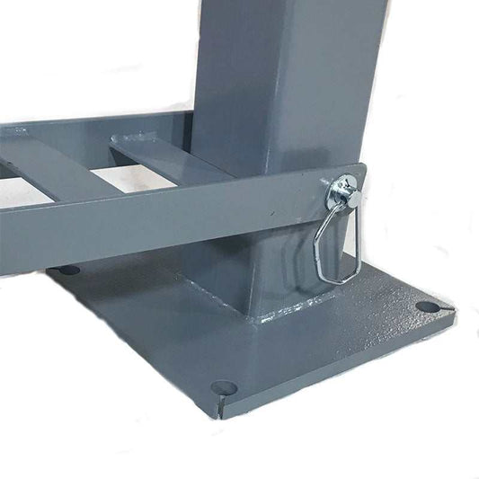 Solid steel base plate with central post for automotive lift stability and durability