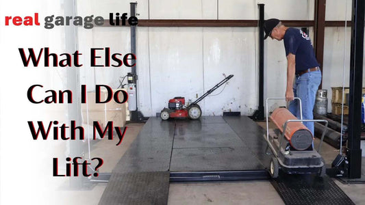 Man using a garage lift with lawn mower and heater showcasing alternative uses of the lift
