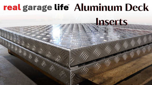 Close-up of Advantage & Backyard Buddy aluminum deck inserts with diamond plate pattern stacked on wooden pallet