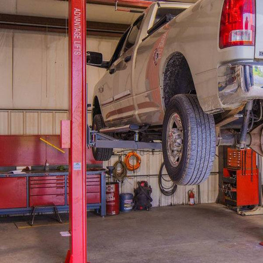 Close-up of vibrant powder coat finish on industrial lift for durable workspace protection