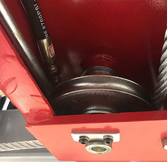 Enhanced underside construction showing nylon pads, adjustable cable block, and reinforced welds under power side runway