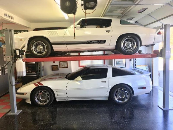 Side profile of Advantage auto lift showcasing two great-looking cars